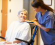 caregiver assisting senior woman on wheelchair