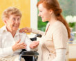 caregiver talking to a senior woman